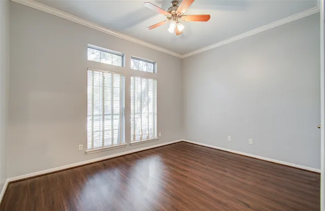 a view of yard with small huts and wooden fence