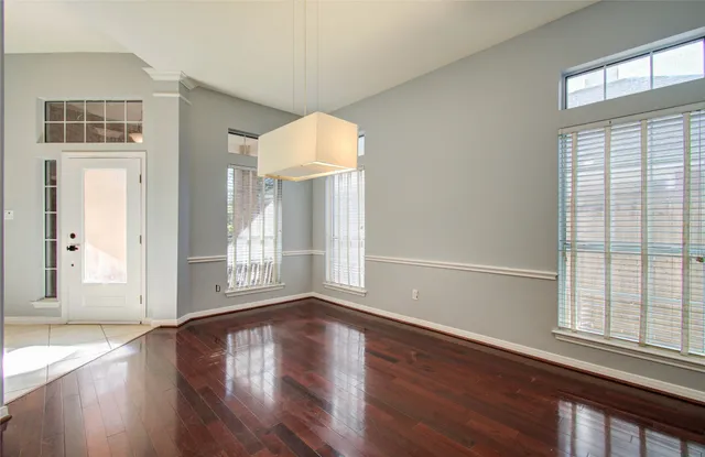 a kitchen with granite countertop a sink and a stove top oven