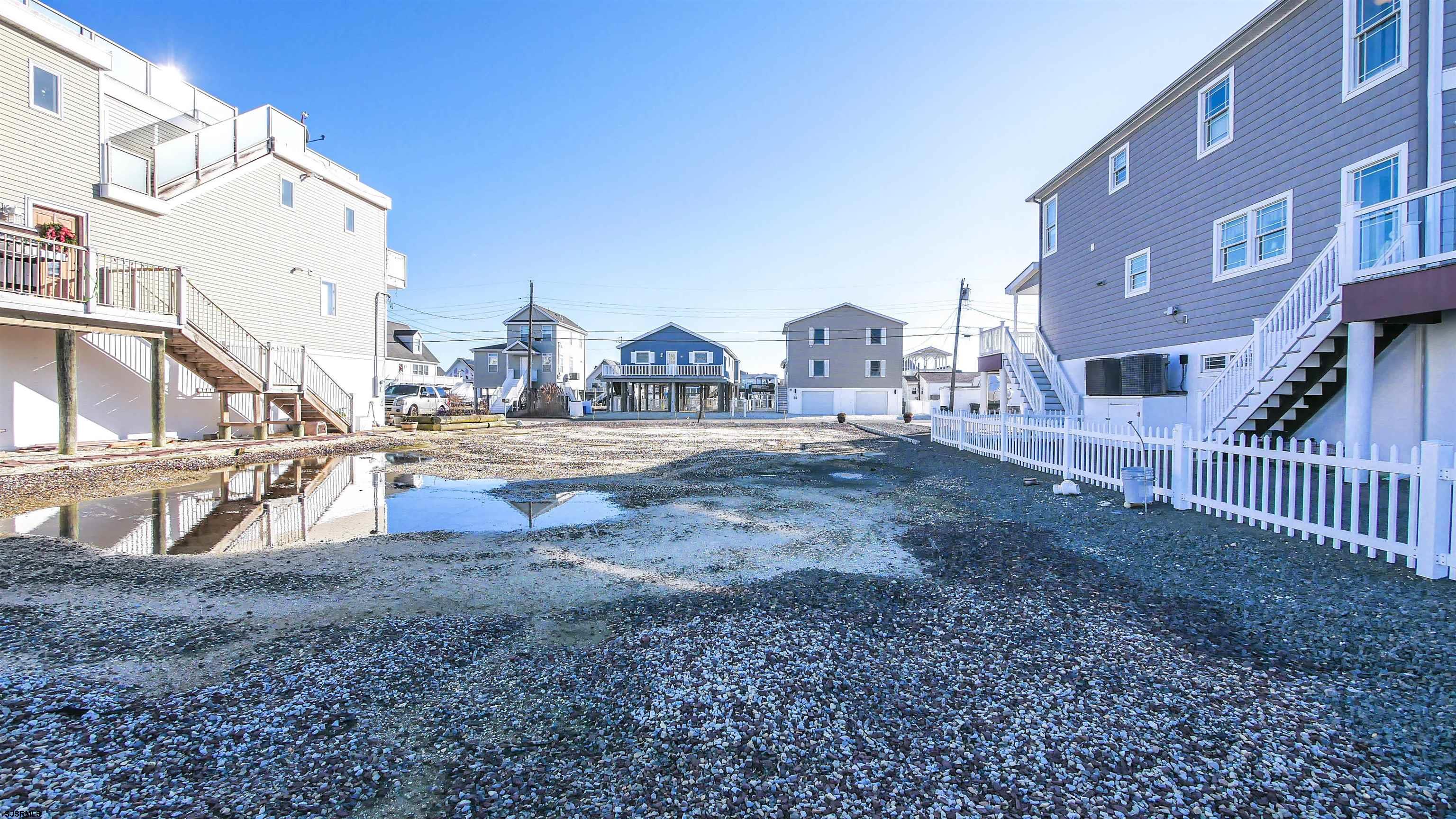 181 Flamingo Road Tuckerton, NJ 08087 - Photo 15 of 16 a view of multiple houses with yard and road