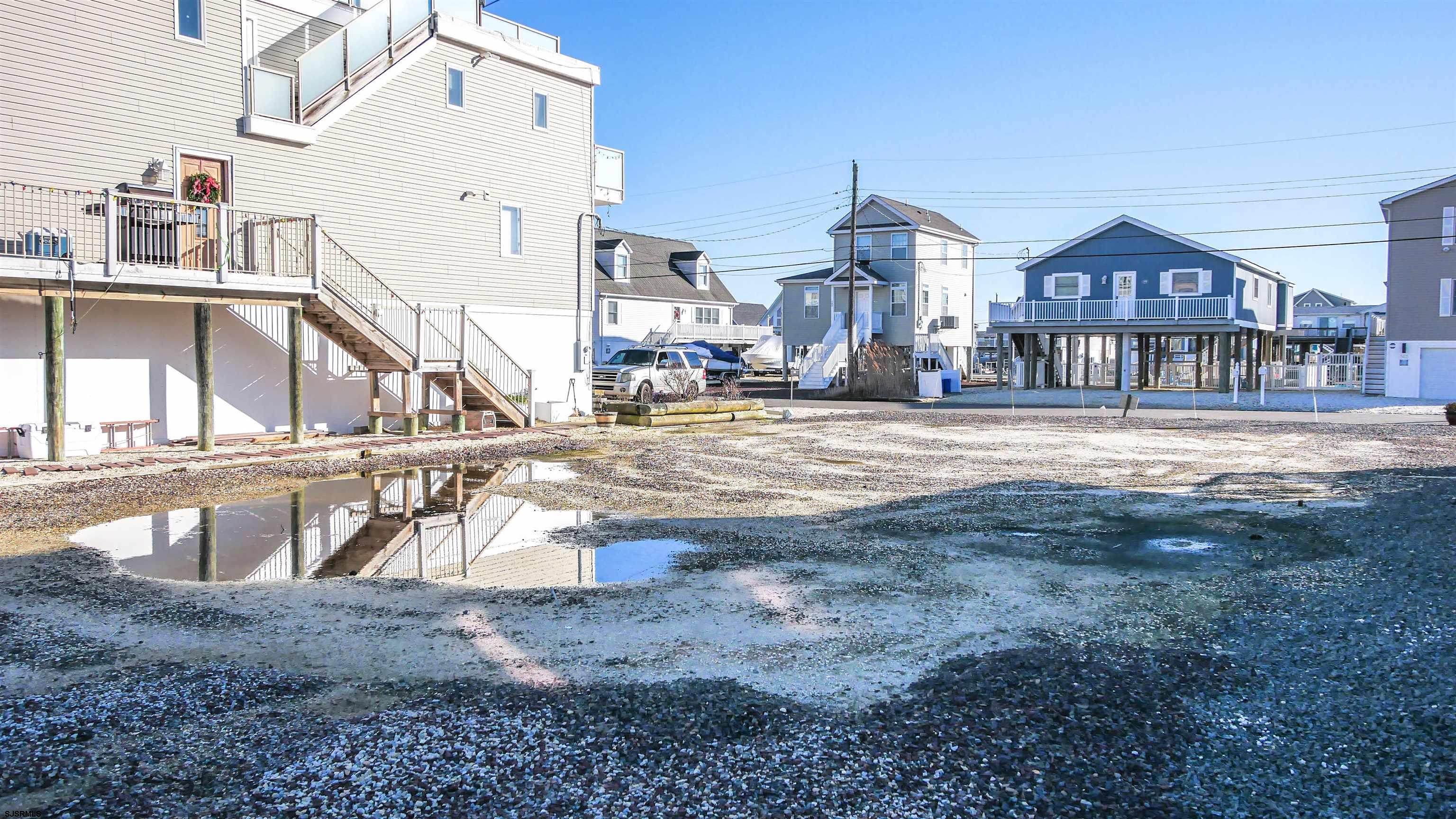 181 Flamingo Road Tuckerton, NJ 08087 - Photo 10 of 16 a view of a house next to a big yard