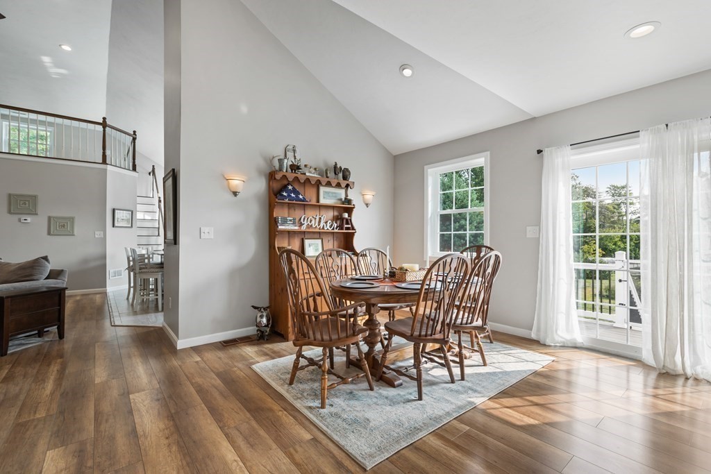 28 Black Point Road Webster, MA 01570 - Photo 13 of 42 a view of a dining room with furniture window and wooden floor