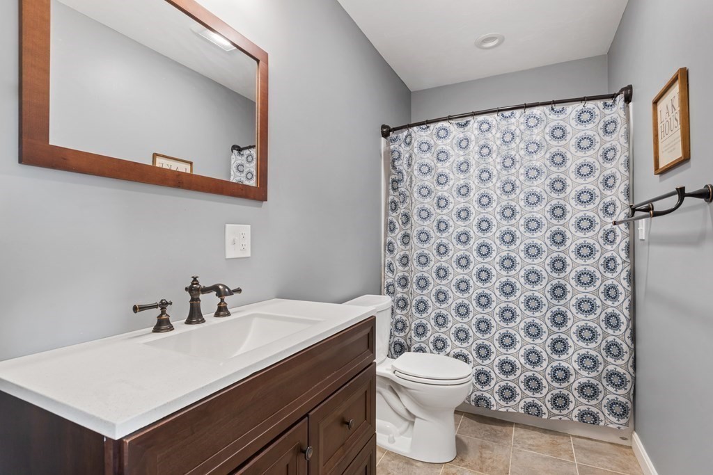 28 Black Point Road Webster, MA 01570 - Photo 22 of 42 a bathroom with a sink toilet and shower