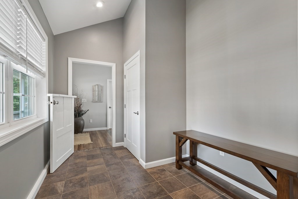 28 Black Point Road Webster, MA 01570 - Photo 23 of 42 a view of a hallway with a room and a window