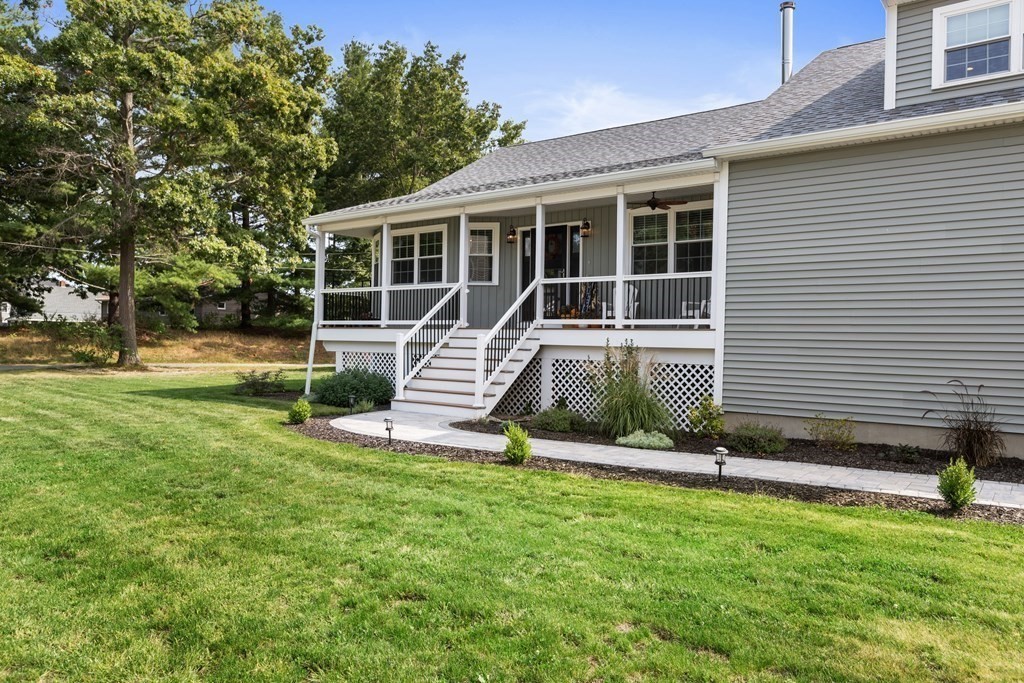 28 Black Point Road Webster, MA 01570 - Photo 33 of 42 a view of a house with backyard sitting area and garden