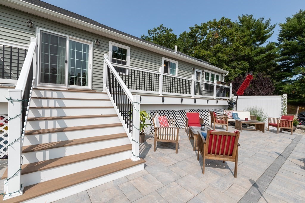 28 Black Point Road Webster, MA 01570 - Photo 37 of 42 a view of a house with a patio and a yard