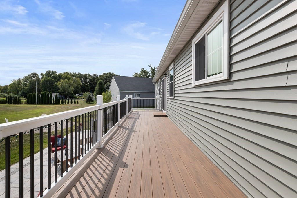 28 Black Point Road Webster, MA 01570 - Photo 38 of 42 a view of a wooden deck with a yard