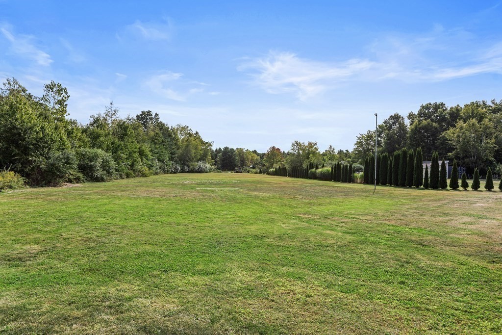 28 Black Point Road Webster, MA 01570 - Photo 40 of 42 a backyard of a house with lots of green space