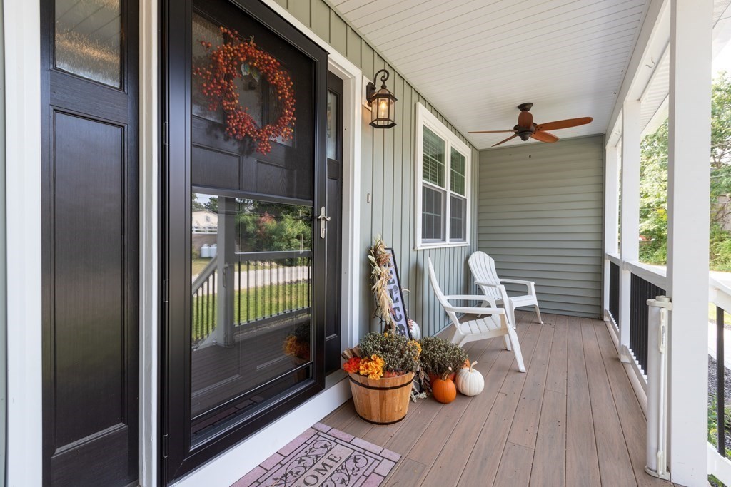 28 Black Point Road Webster, MA 01570 - Photo 4 of 42 a balcony view with a potted plant and a glass door