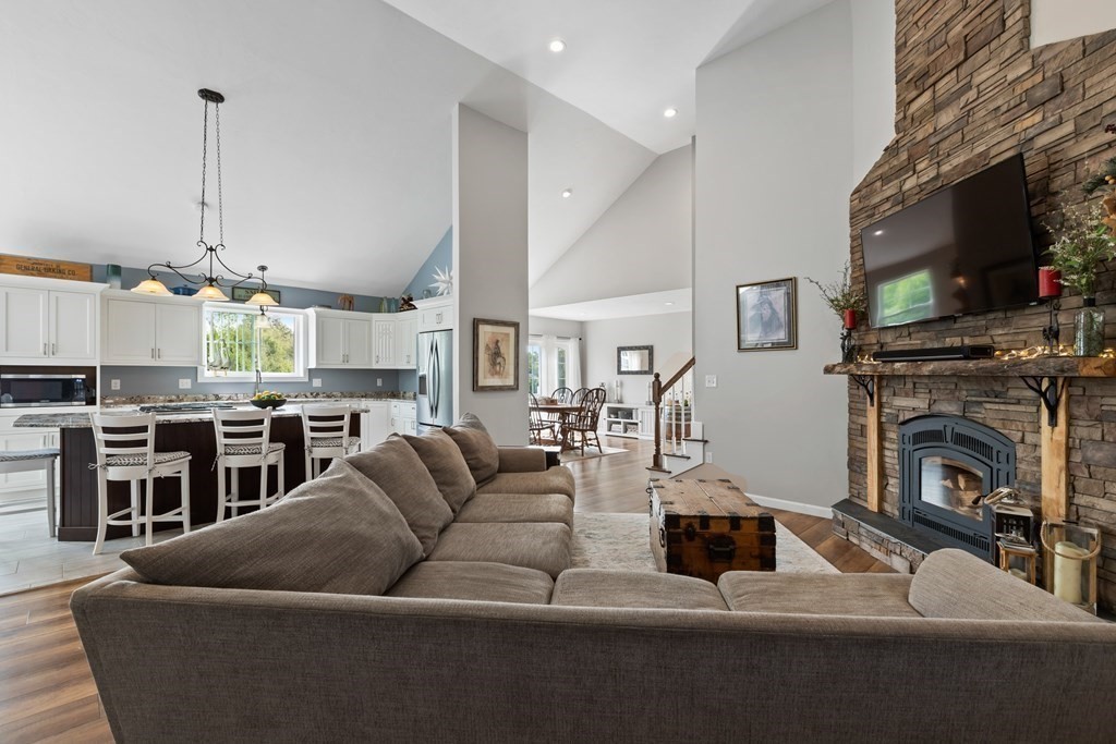 28 Black Point Road Webster, MA 01570 - Photo 6 of 42 a living room with furniture fireplace and flat screen tv
