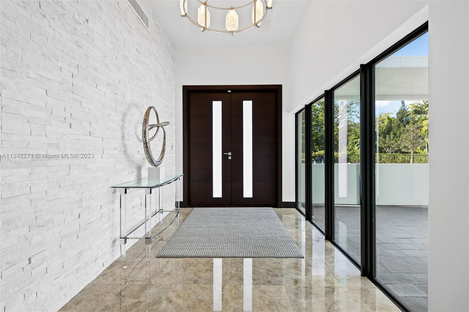 2610 Oak Park Drive Davie, FL 33325 - Photo 19 of 60 a view of entryway with a front door and wooden floor