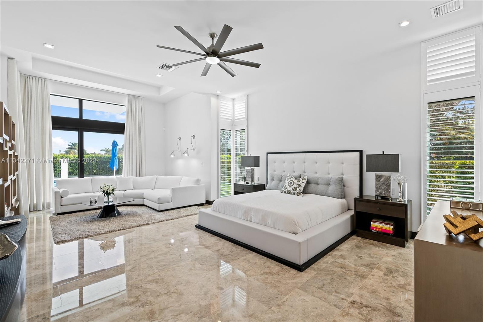 2610 Oak Park Drive Davie, FL 33325 - Photo 20 of 60 a spacious bedroom with a bed and a couch