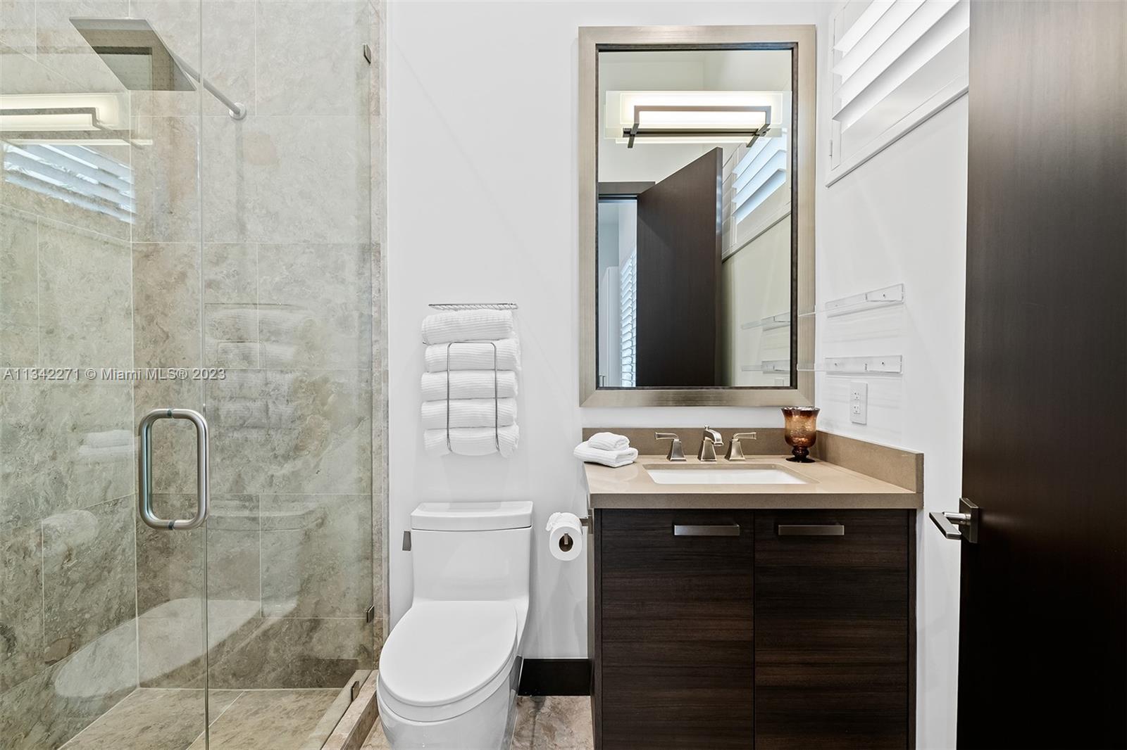 2610 Oak Park Drive Davie, FL 33325 - Photo 30 of 60 a bathroom with a sink a toilet and shower