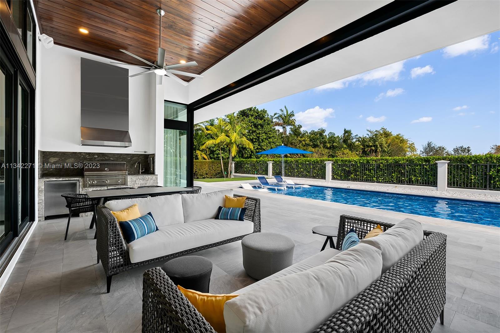 2610 Oak Park Drive Davie, FL 33325 - Photo 37 of 60 a outdoor living space with furniture and a floor to ceiling window