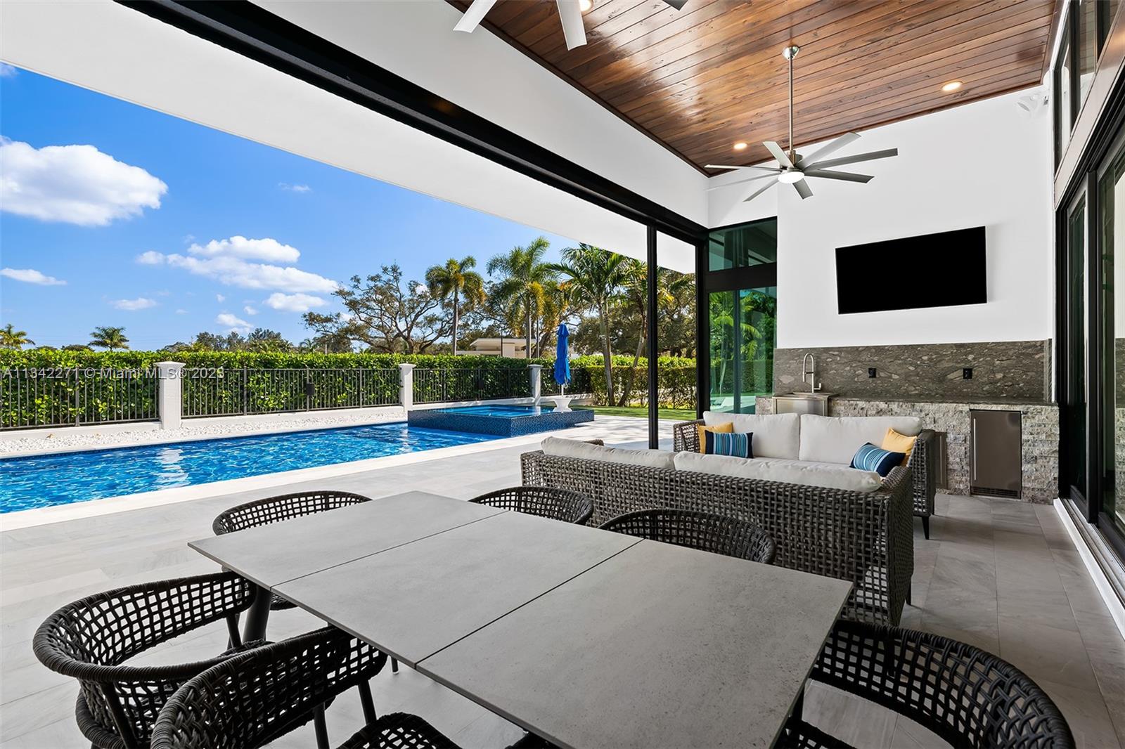 2610 Oak Park Drive Davie, FL 33325 - Photo 38 of 60 a view of a patio with couches chairs dining table and chairs