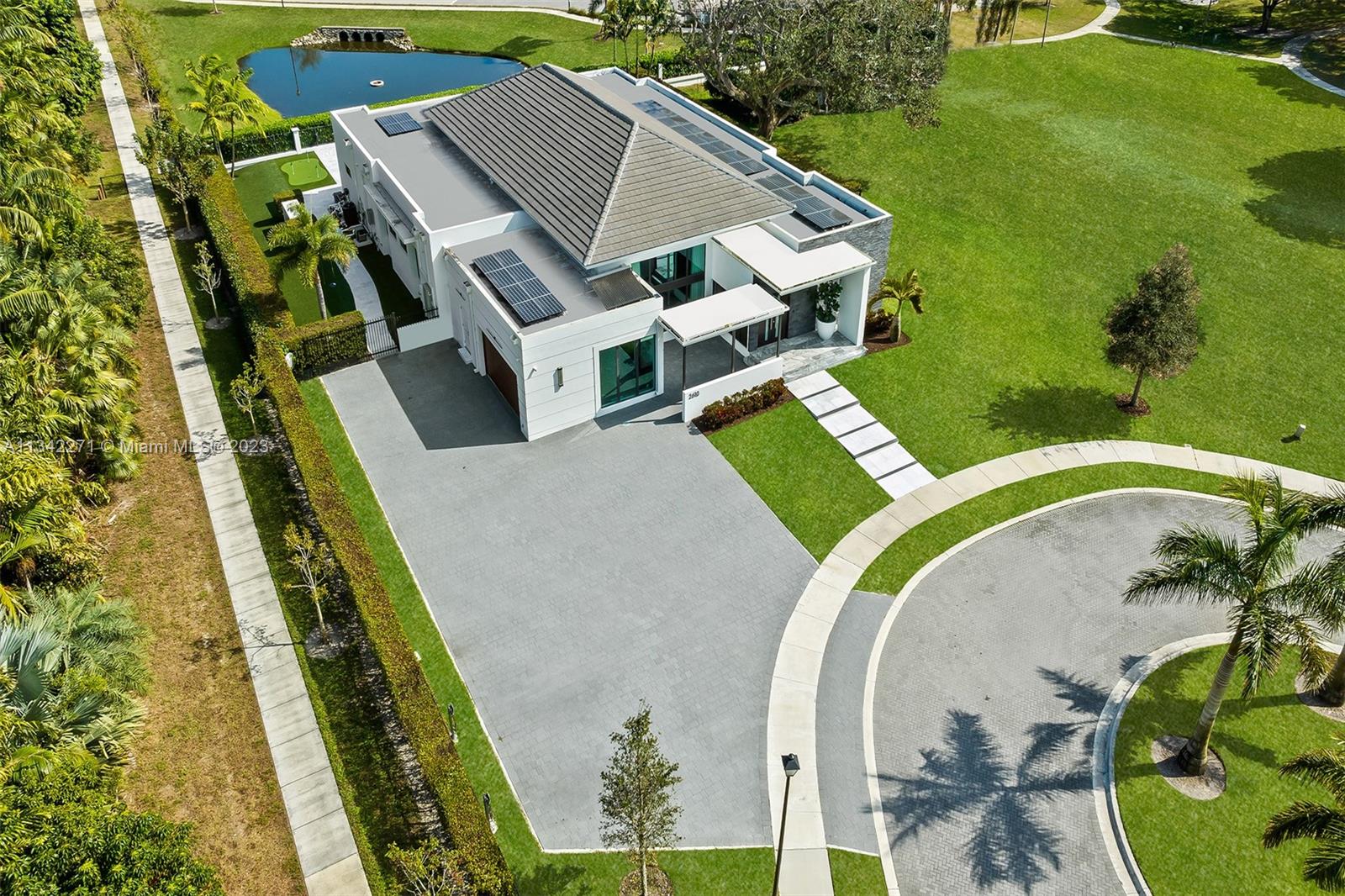 2610 Oak Park Drive Davie, FL 33325 - Photo 46 of 60 an aerial view of a house with a garden