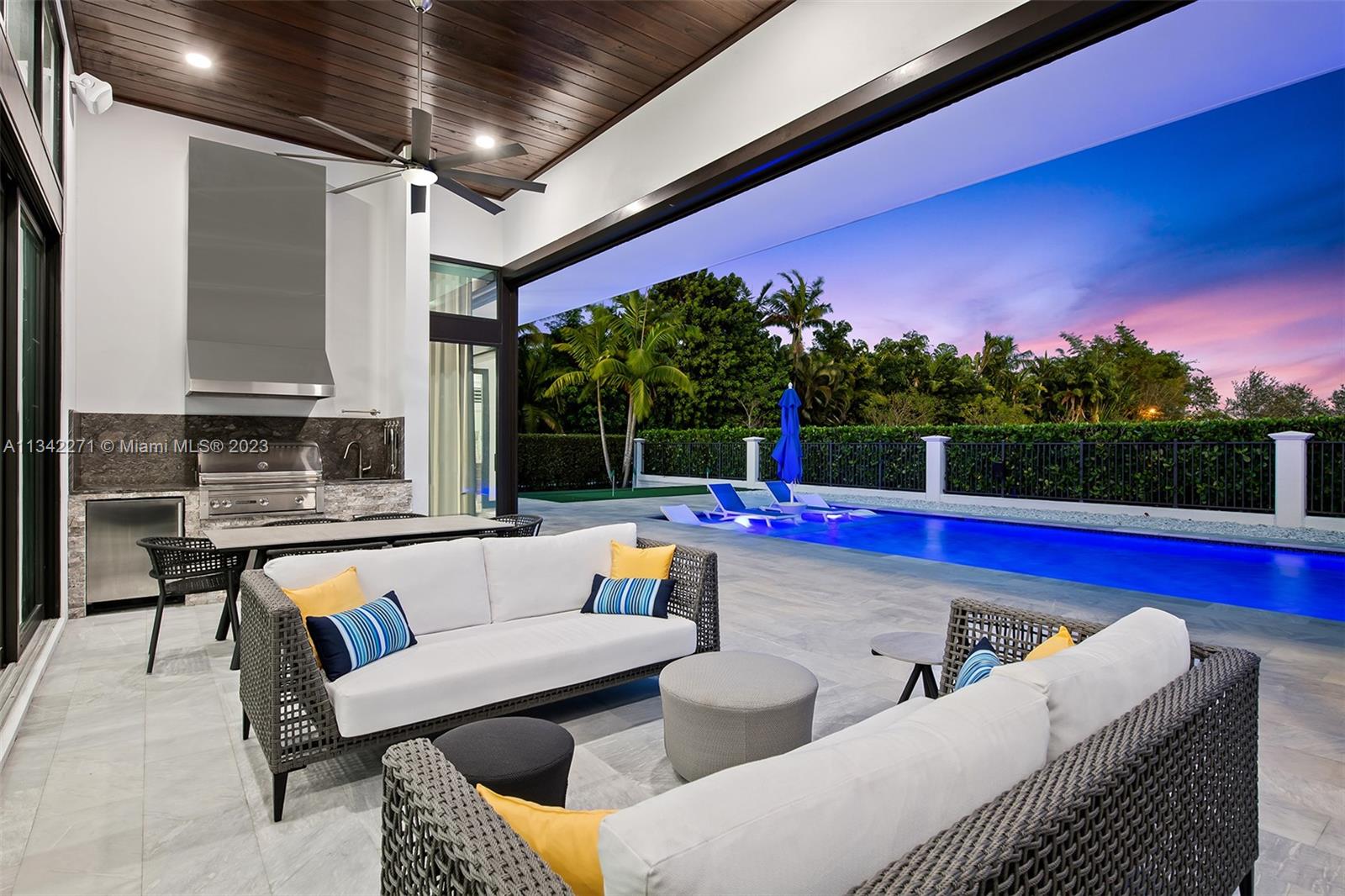 2610 Oak Park Drive Davie, FL 33325 - Photo 52 of 60 a view of swimming pool with seating space and couches in the patio