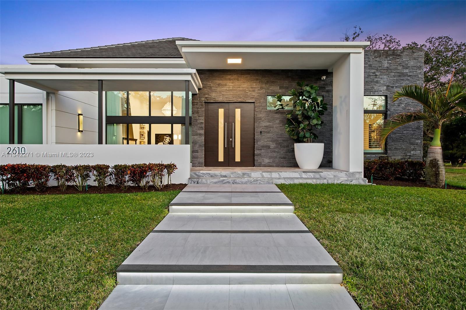 2610 Oak Park Drive Davie, FL 33325 - Photo 55 of 60 a front view of a house with a yard