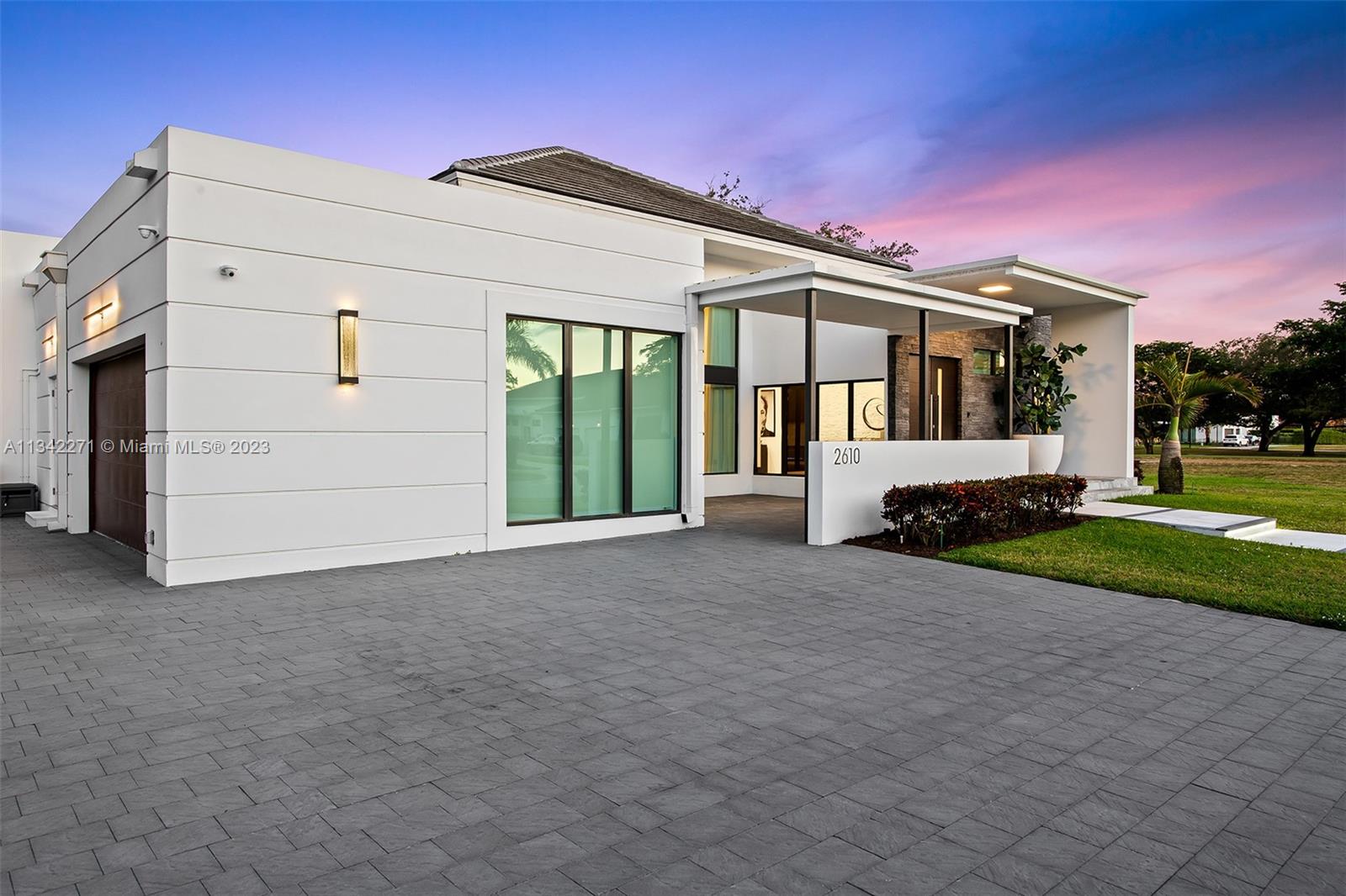 2610 Oak Park Drive Davie, FL 33325 - Photo 56 of 60 a view of a house with a yard