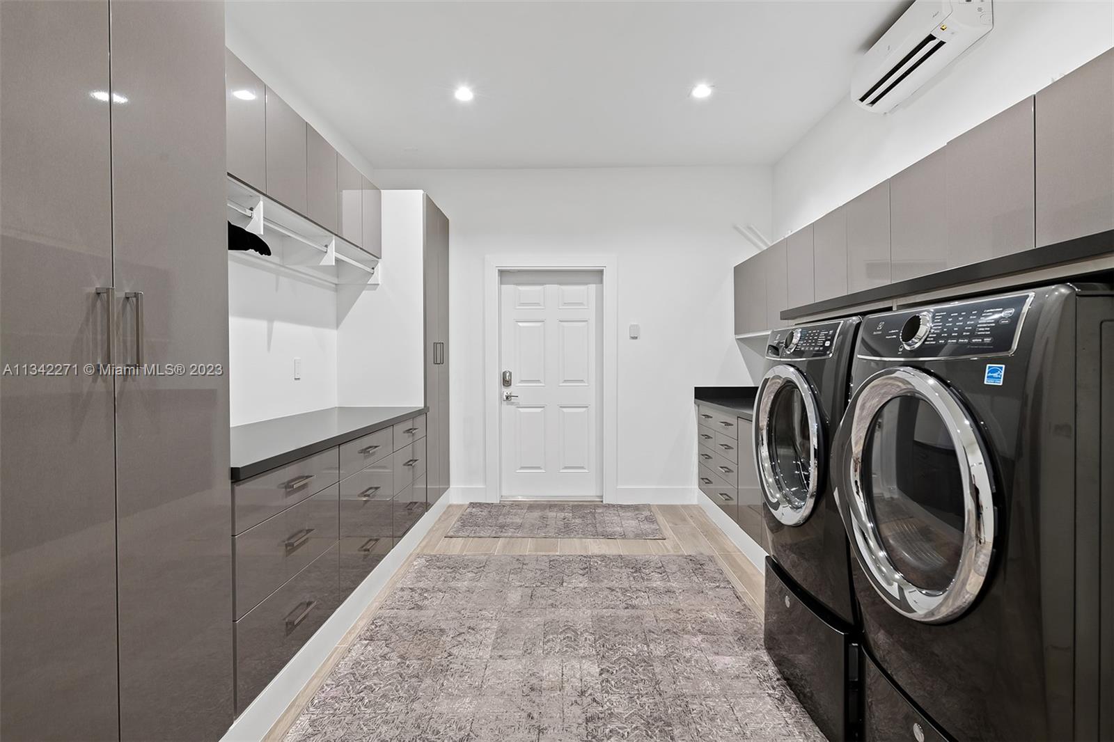 2610 Oak Park Drive Davie, FL 33325 - Photo 58 of 60 a view of a hallway with washer and dryer