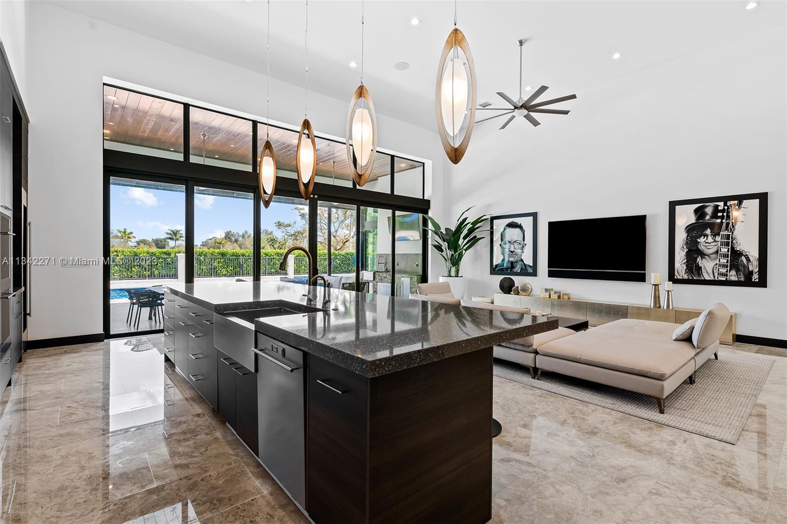2610 Oak Park Drive Davie, FL 33325 - Photo 7 of 60 a living room with furniture tv and a large window