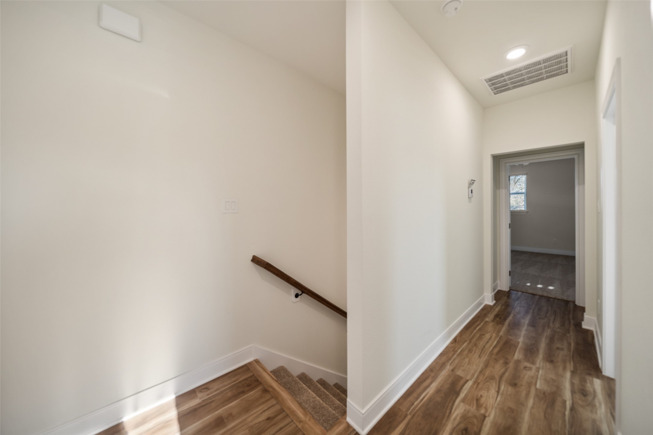 412 West Marlin Street Willis, TX 77378 - Photo 11 of 22 a view of hallway with wooden floor