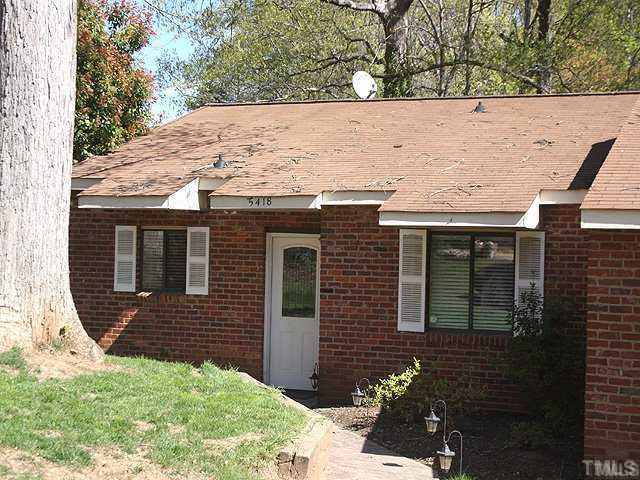 5418 Wayne Street Raleigh, NC 27606 - Photo 1 of 11 All Brick Veneer Ranch Townhome, Stamped Concret Walkway, Landscaped, Two Front Windows, directly facing the Parking Lot. Exterior Front