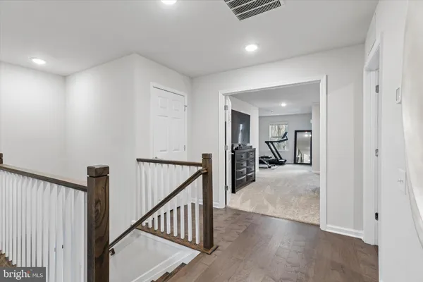 a view of a hallway with dining area