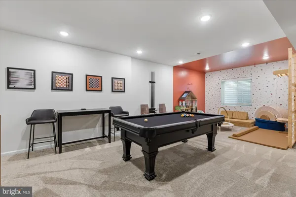 a room with furniture pool table and a table