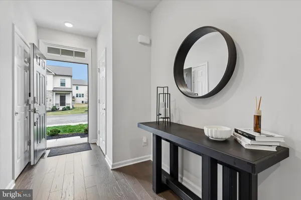 a kitchen with sink and a mirror