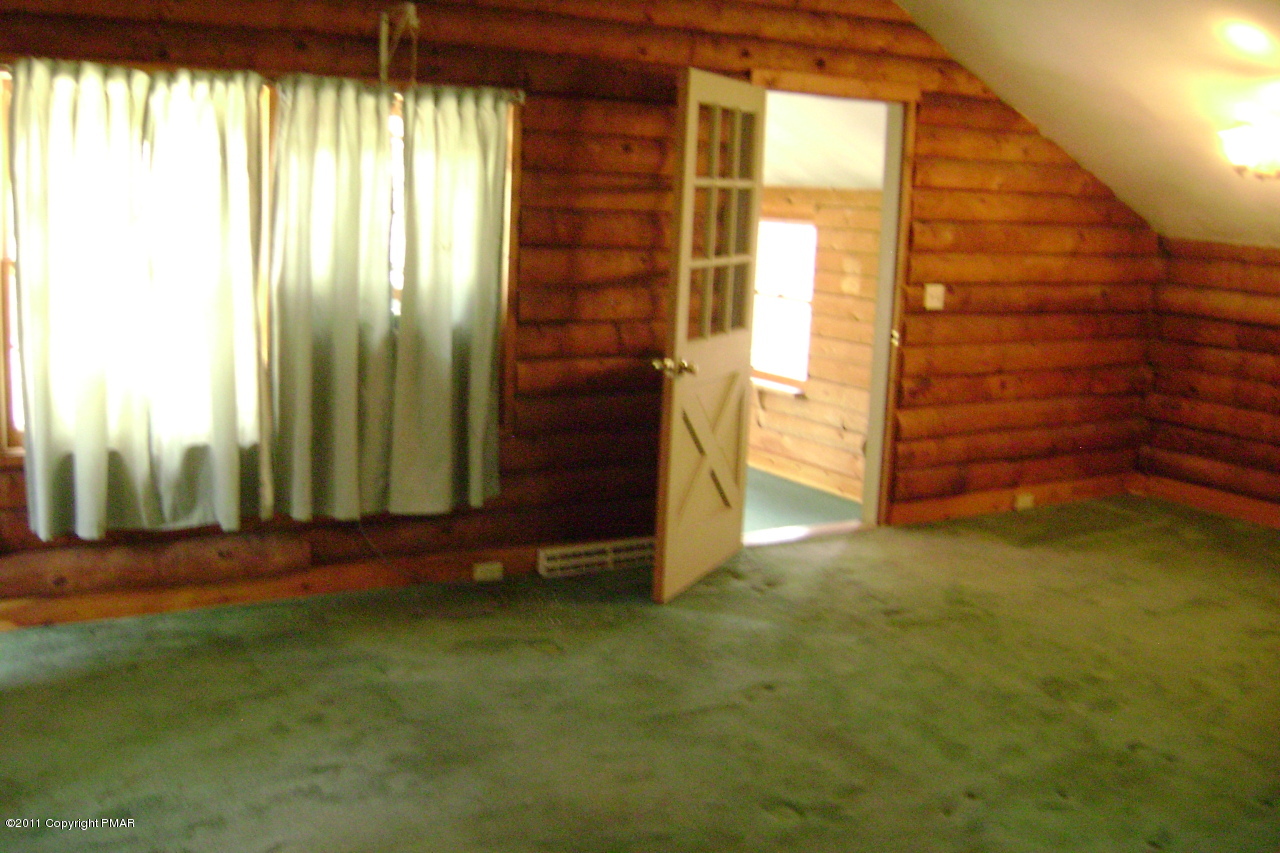 T464 West Gilbert Road Effort, PA 18330 - Photo 4 of 17 a view of a room with window and door