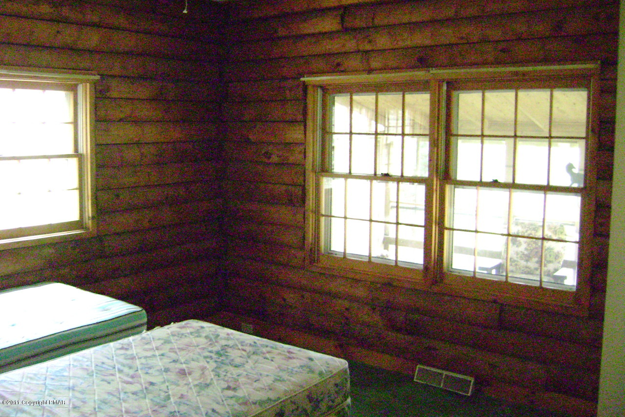 T464 West Gilbert Road Effort, PA 18330 - Photo 8 of 17 a room with a bed and a window