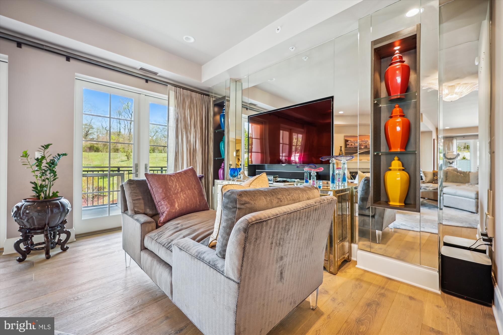 8121 River Road, Unit 451 Bethesda, MD 20817 - Photo 12 of 94 a living room with furniture and a floor to ceiling window