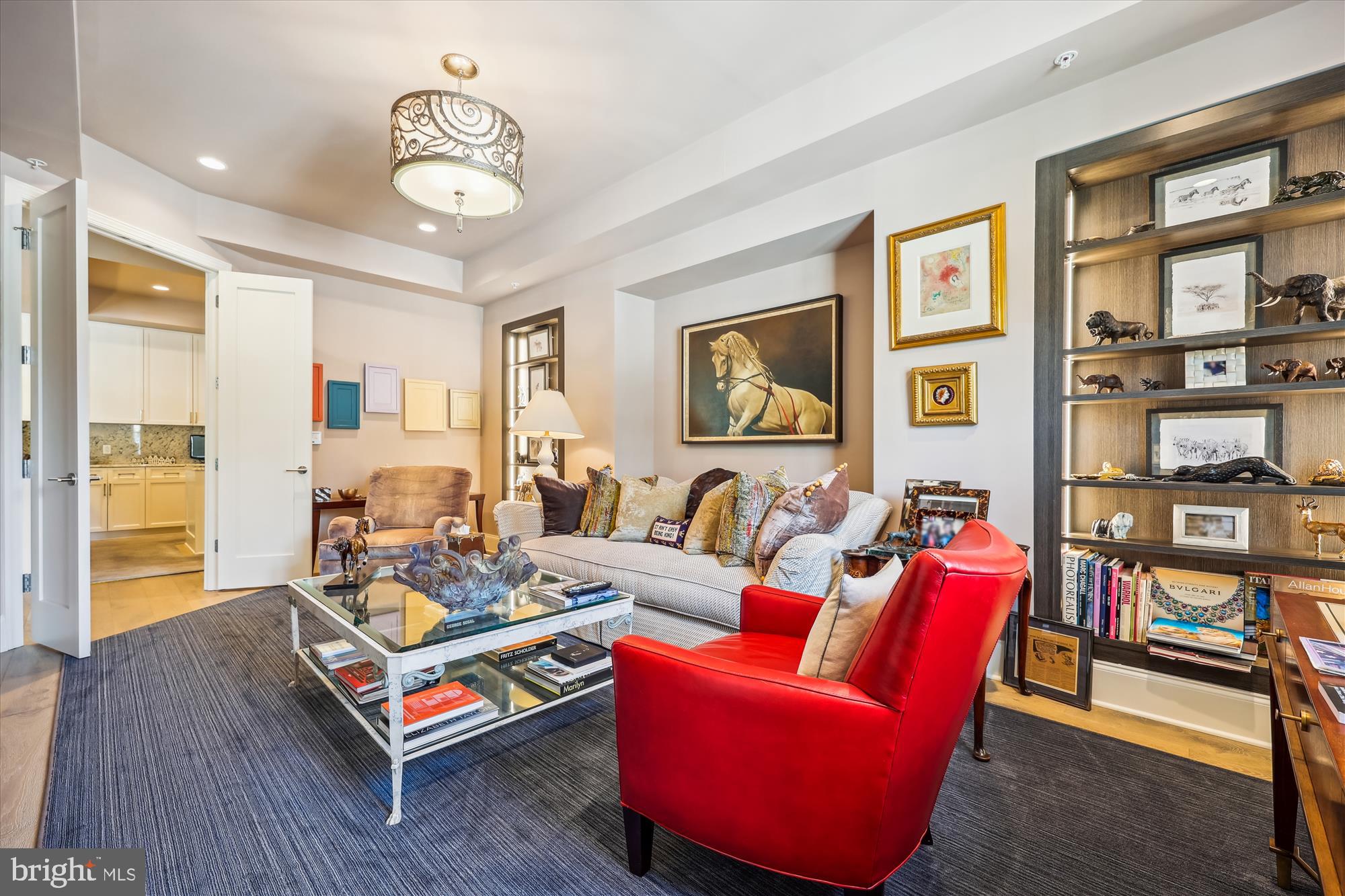 8121 River Road, Unit 451 Bethesda, MD 20817 - Photo 25 of 94 a living room with furniture a flat screen tv and a table