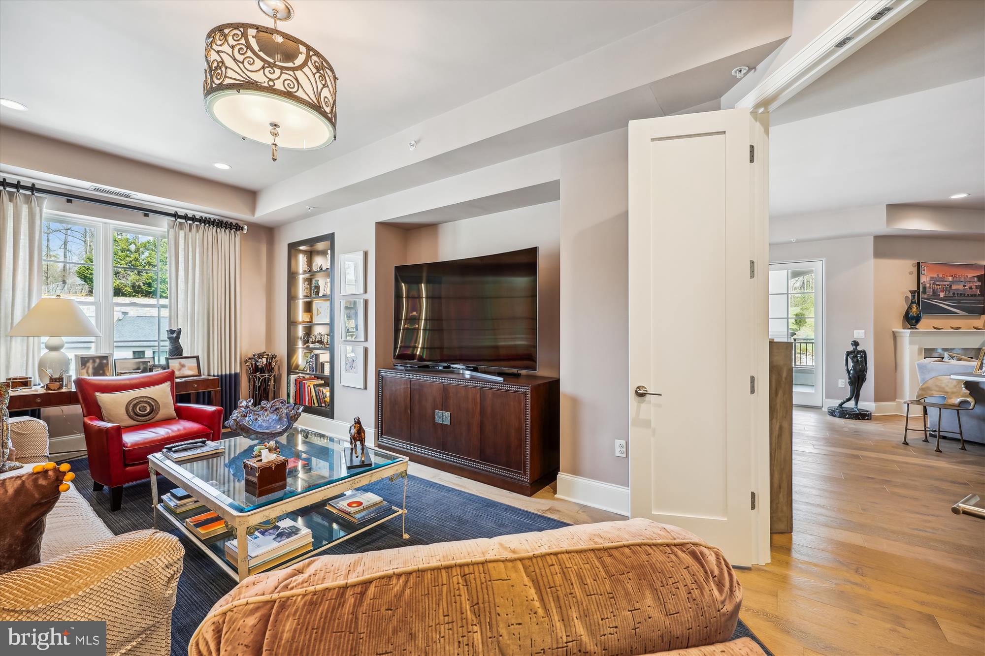 8121 River Road, Unit 451 Bethesda, MD 20817 - Photo 27 of 94 a living room with furniture and a flat screen tv