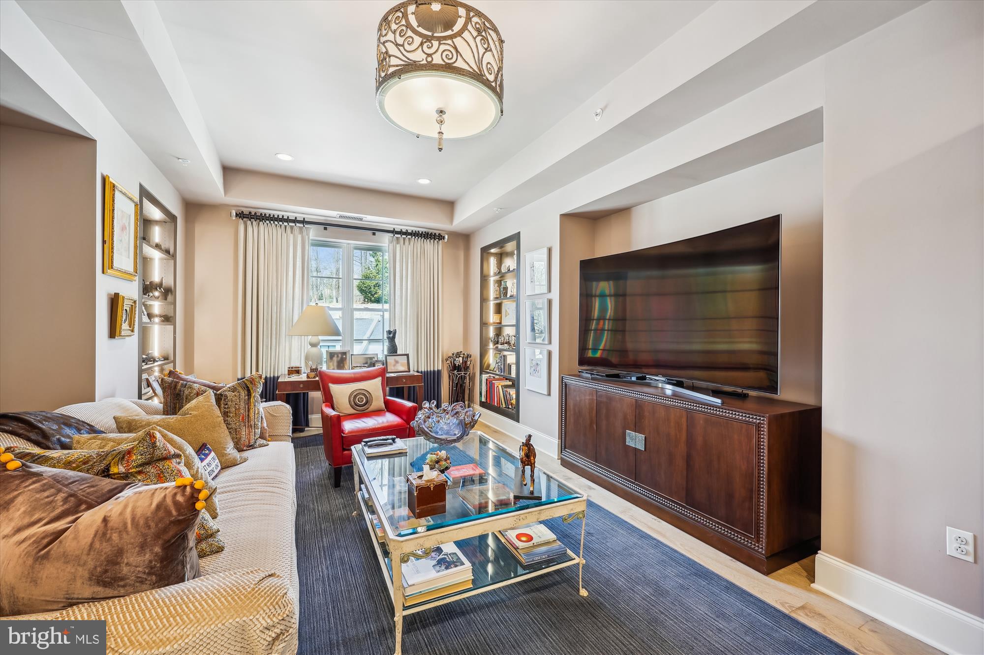 8121 River Road, Unit 451 Bethesda, MD 20817 - Photo 28 of 94 a living room with furniture and a flat screen tv