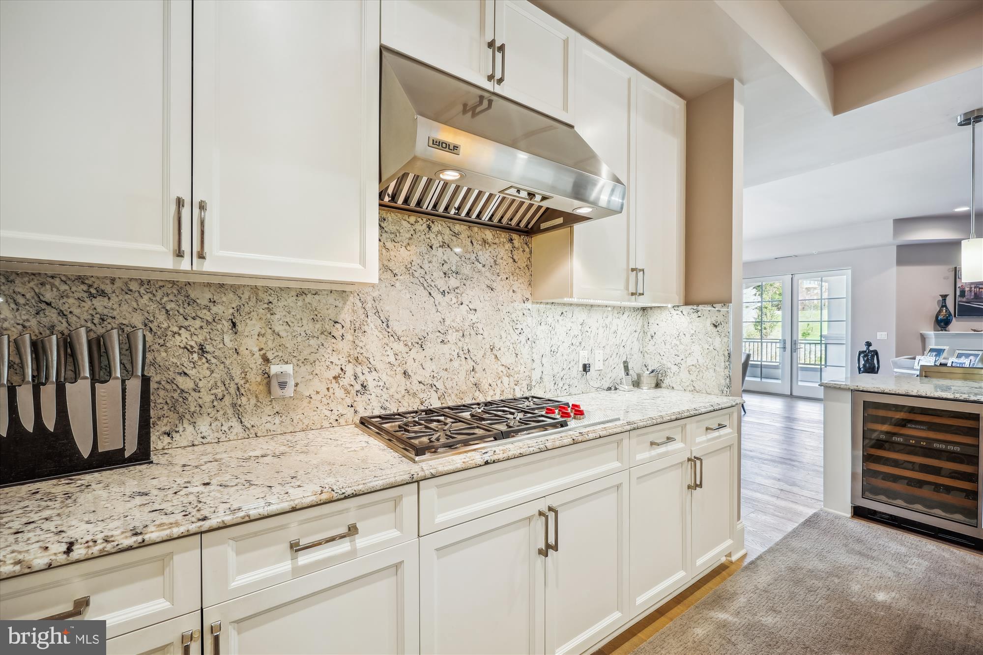 8121 River Road, Unit 451 Bethesda, MD 20817 - Photo 31 of 94 a kitchen with granite countertop a sink cabinets and stove