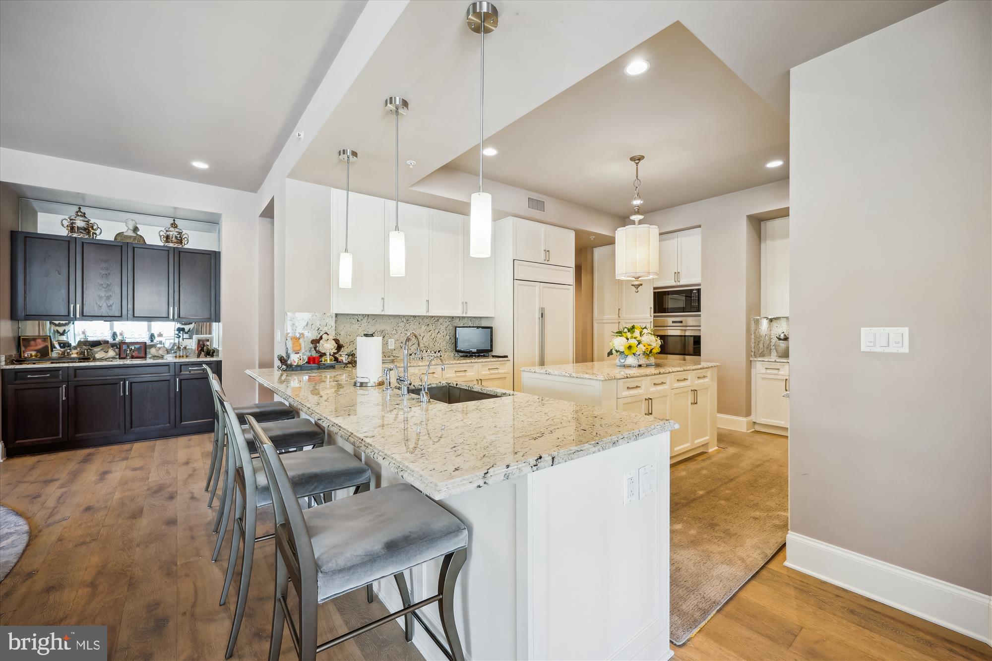 8121 River Road, Unit 451 Bethesda, MD 20817 - Photo 33 of 94 a large kitchen with granite countertop lots of counter space and windows