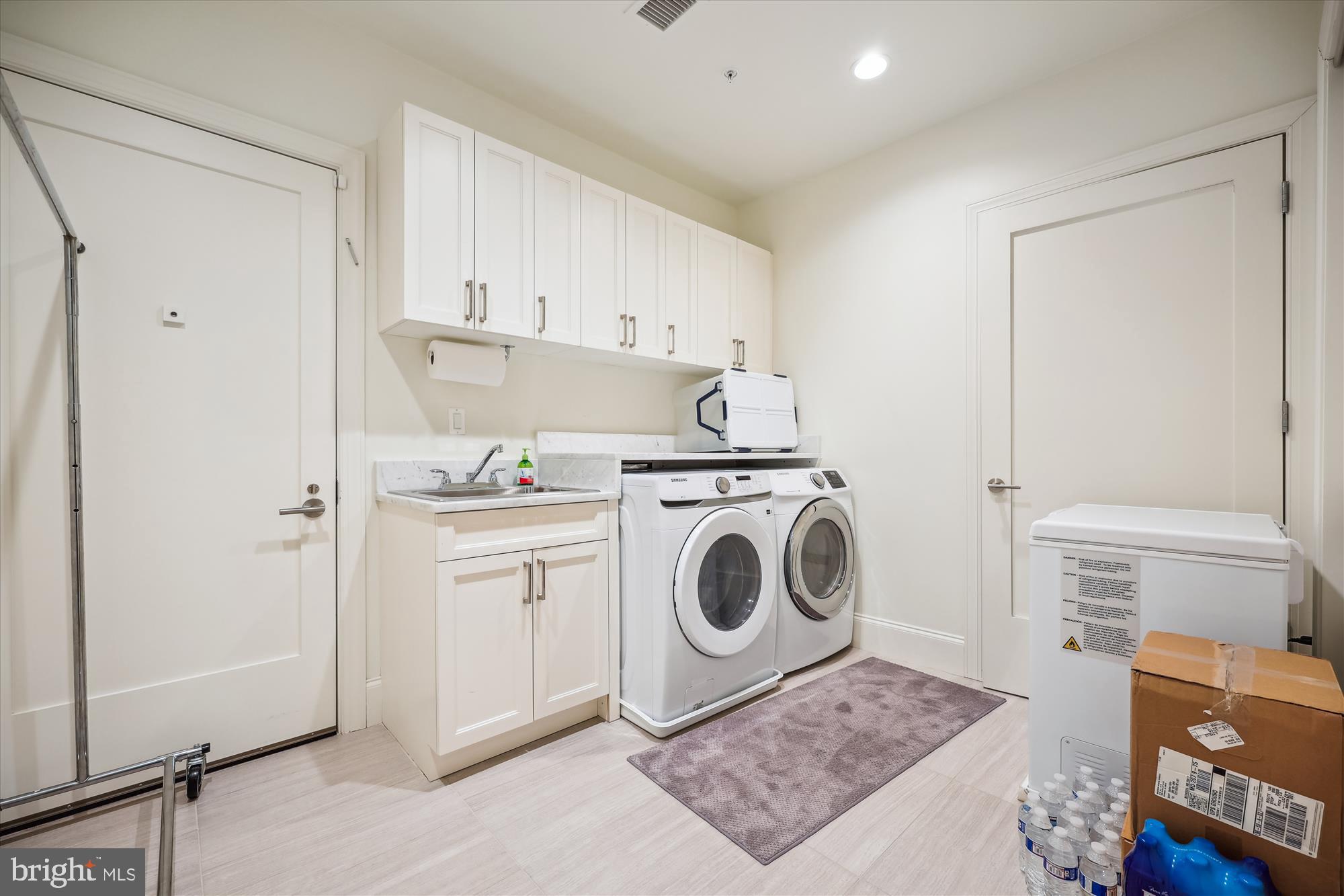 8121 River Road, Unit 451 Bethesda, MD 20817 - Photo 38 of 94 a utility room with sink dryer and washer