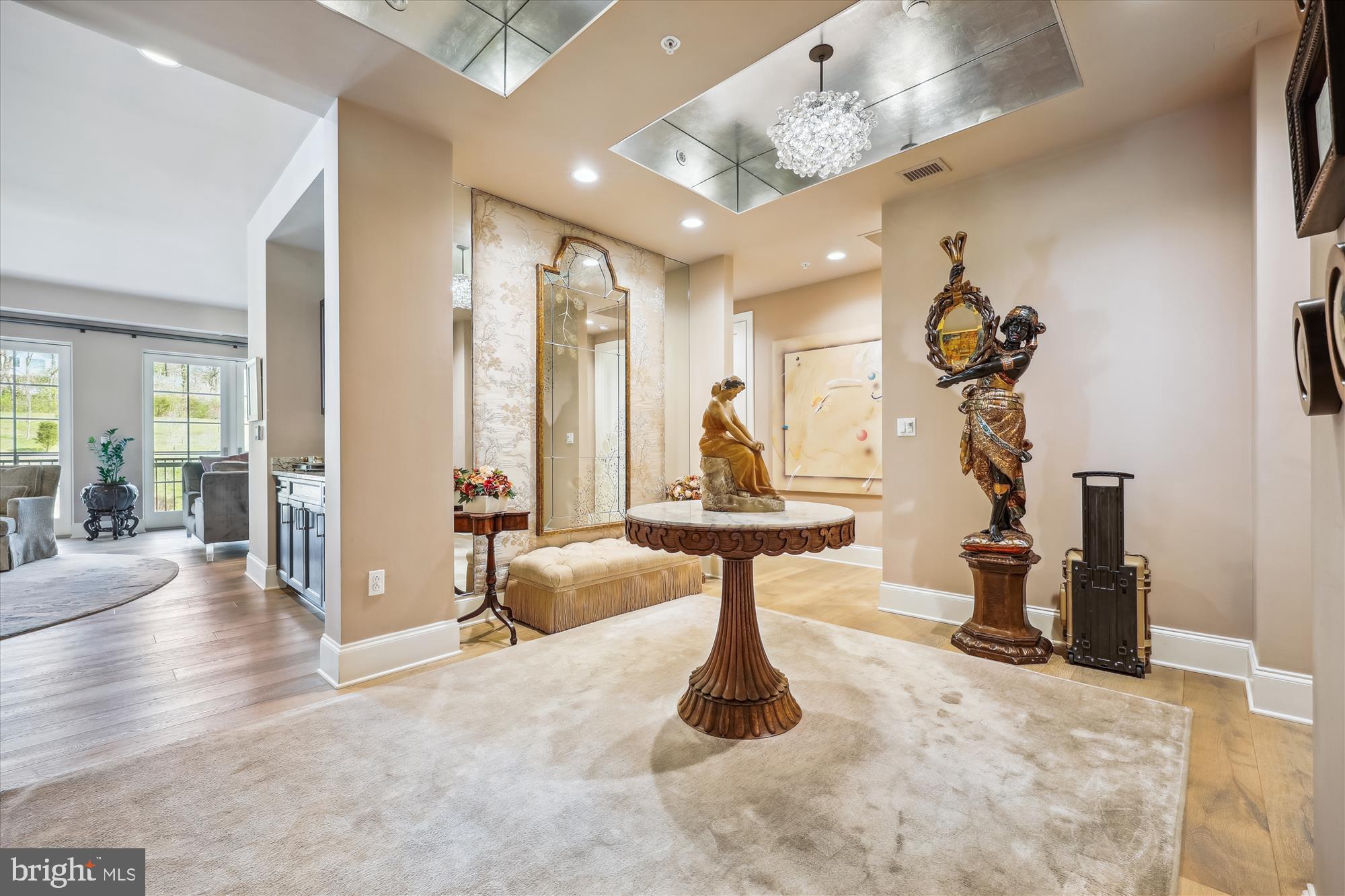 8121 River Road, Unit 451 Bethesda, MD 20817 - Photo 4 of 94 a view of a livingroom with furniture and a chandelier