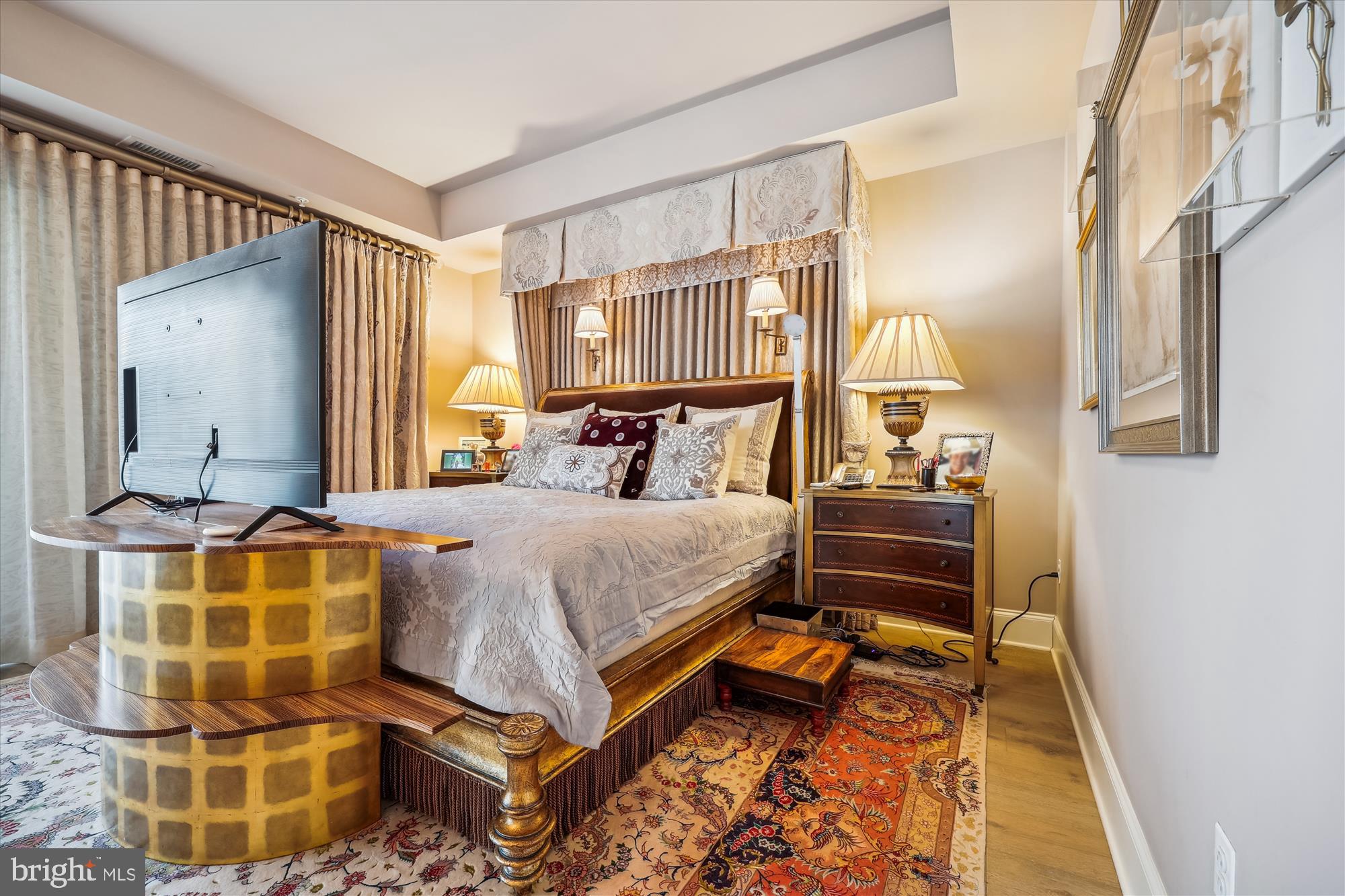 8121 River Road, Unit 451 Bethesda, MD 20817 - Photo 45 of 94 a bedroom with a bed and wooden floor