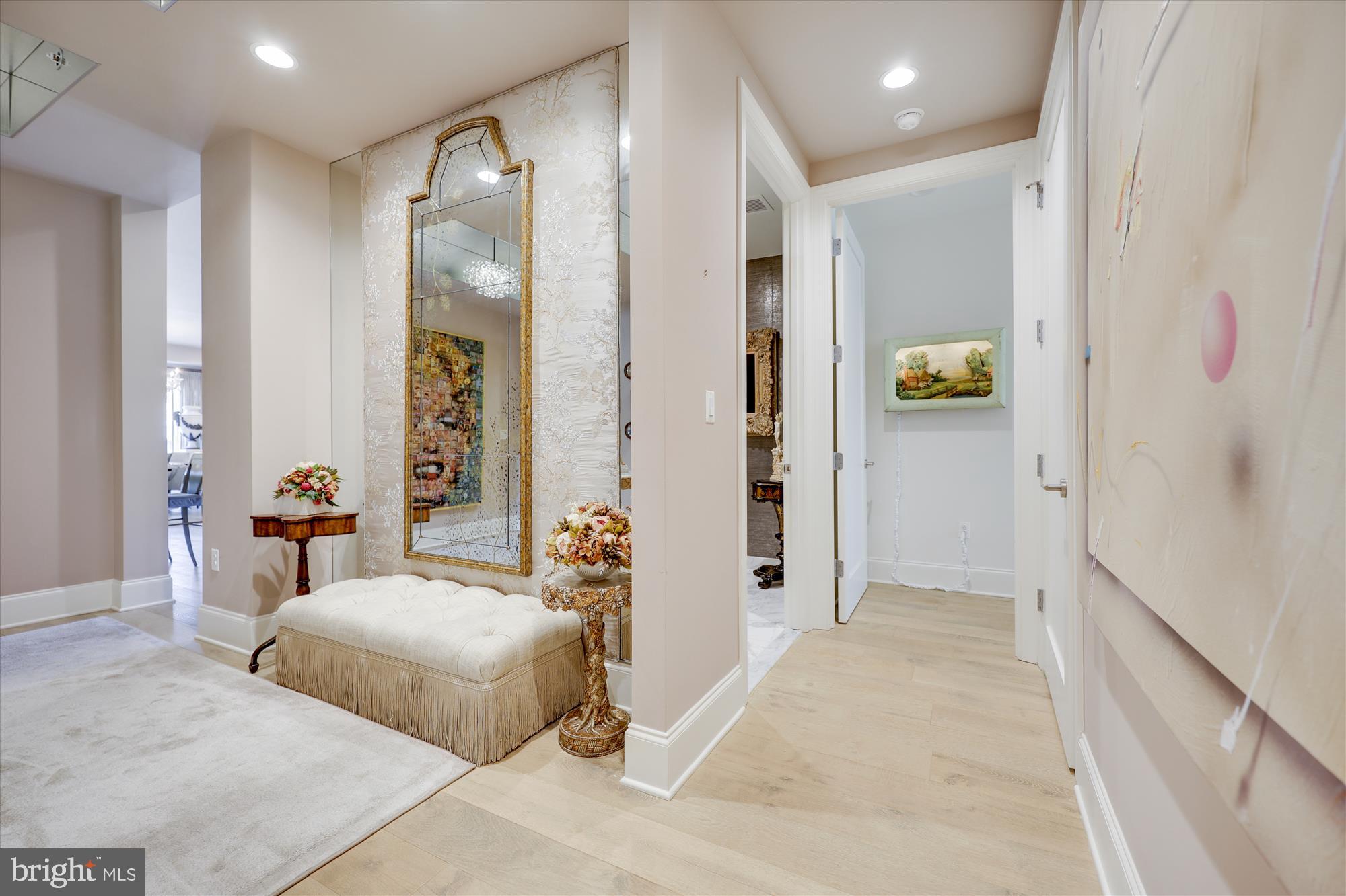 8121 River Road, Unit 451 Bethesda, MD 20817 - Photo 5 of 94 a spacious bedroom with a bed and a chandelier