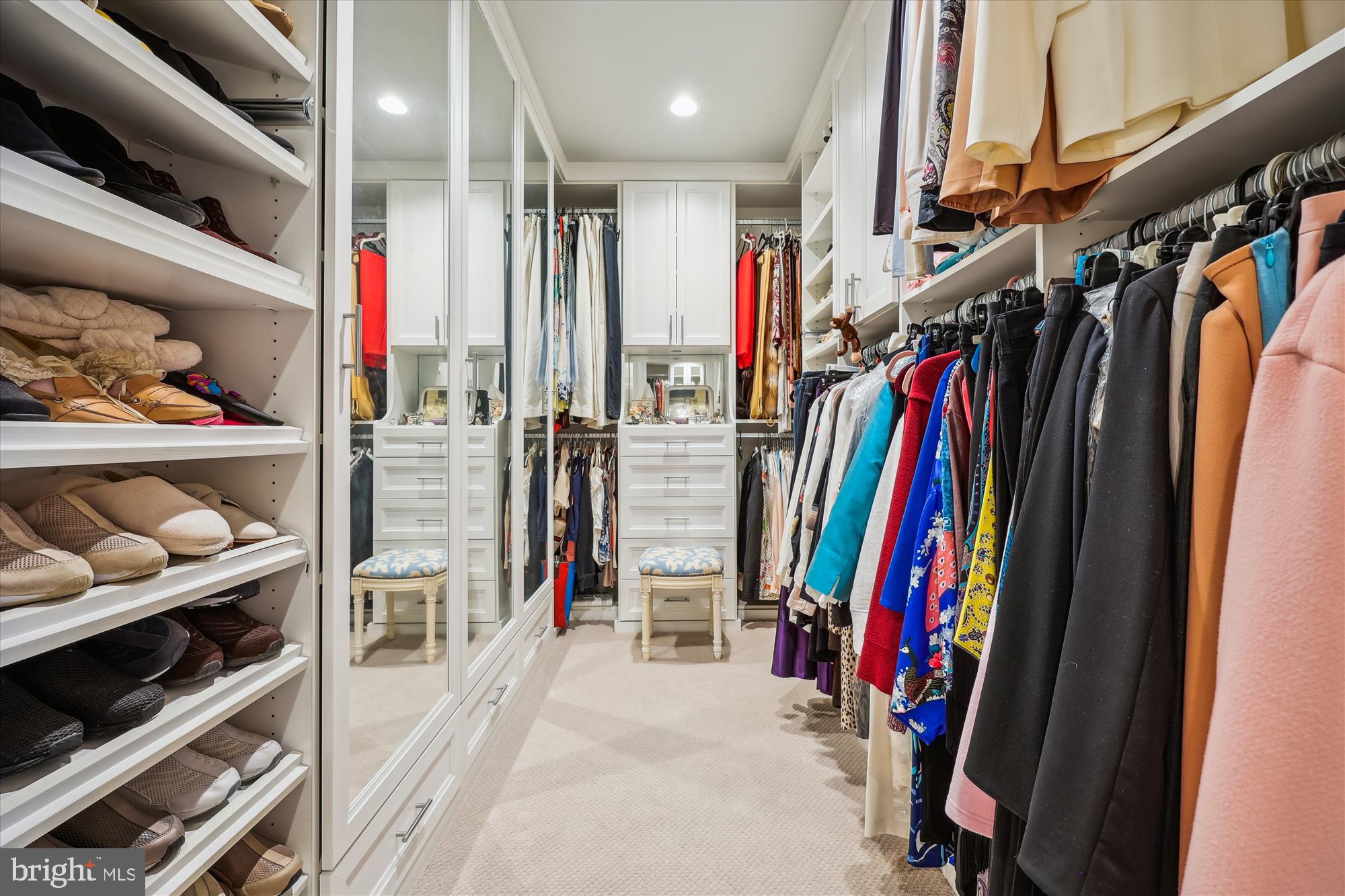 8121 River Road, Unit 451 Bethesda, MD 20817 - Photo 60 of 94 a view of walk in closet with clothes and shoes