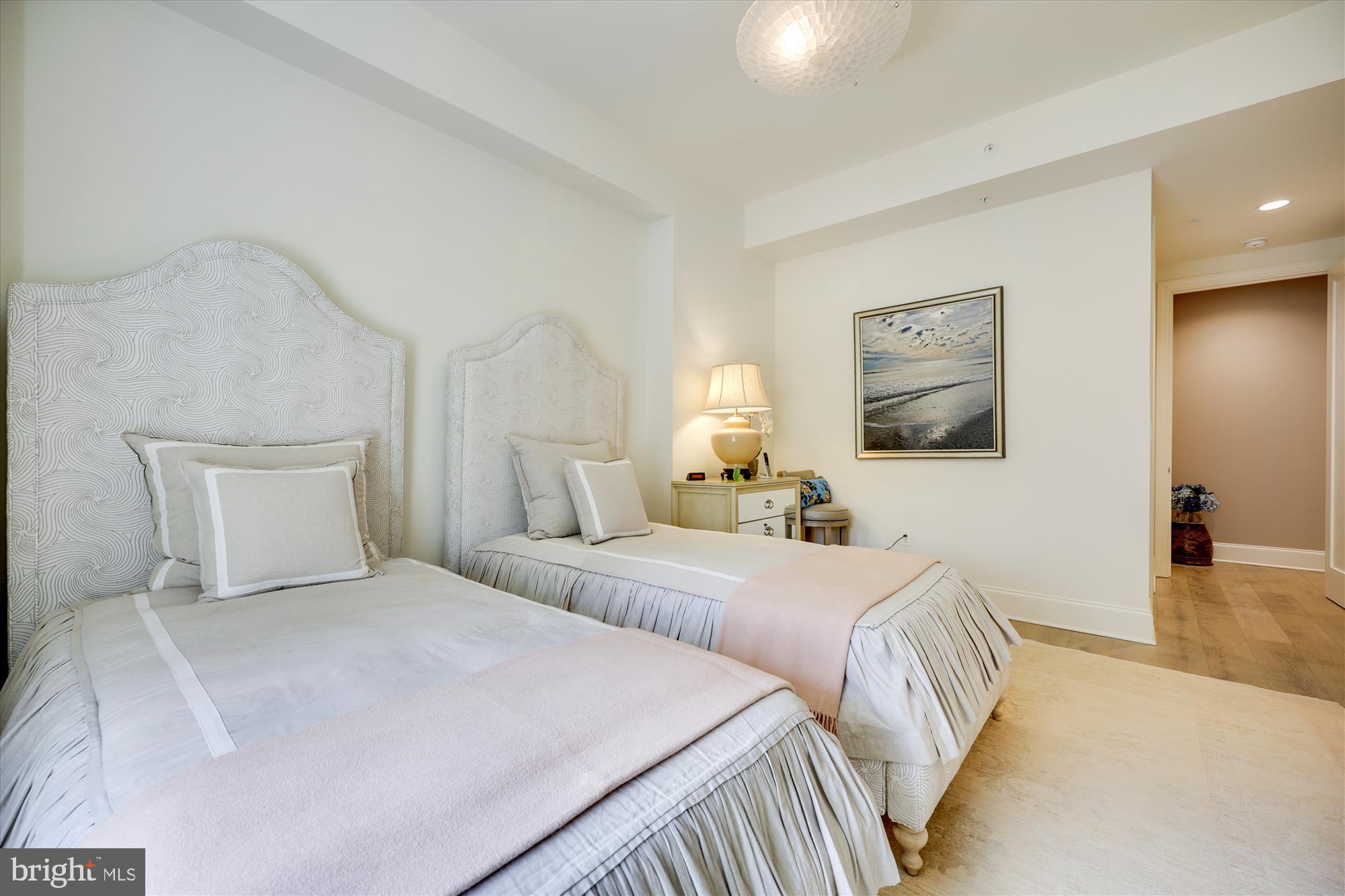 8121 River Road, Unit 451 Bethesda, MD 20817 - Photo 70 of 94 a bedroom with two beds and painting on the wall