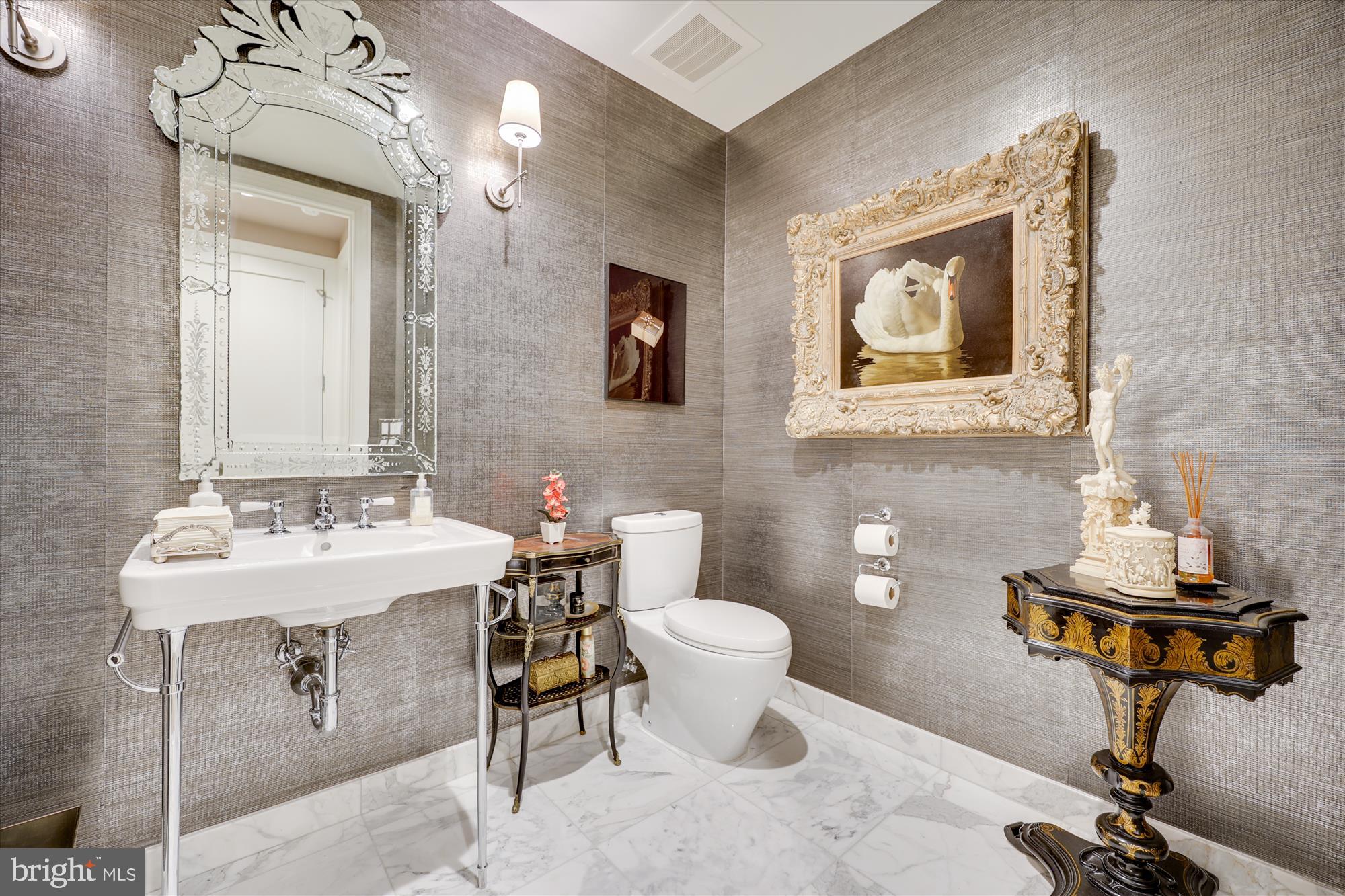8121 River Road, Unit 451 Bethesda, MD 20817 - Photo 7 of 94 a bathroom with a toilet a sink and mirror