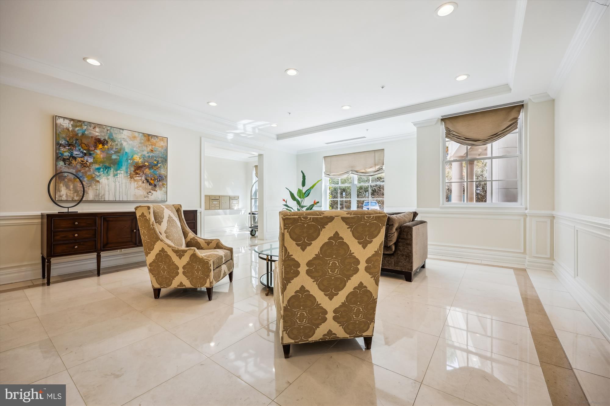 8121 River Road, Unit 451 Bethesda, MD 20817 - Photo 79 of 94 a living room with furniture and a flat screen tv