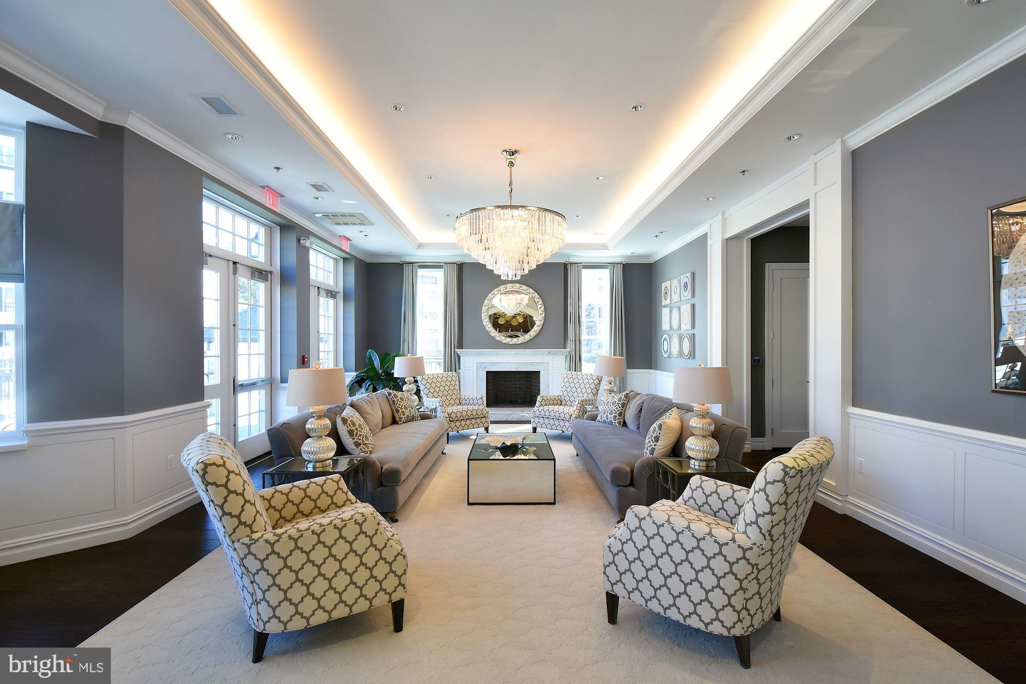 8121 River Road, Unit 451 Bethesda, MD 20817 - Photo 82 of 94 a living room with furniture a chandelier and a large window