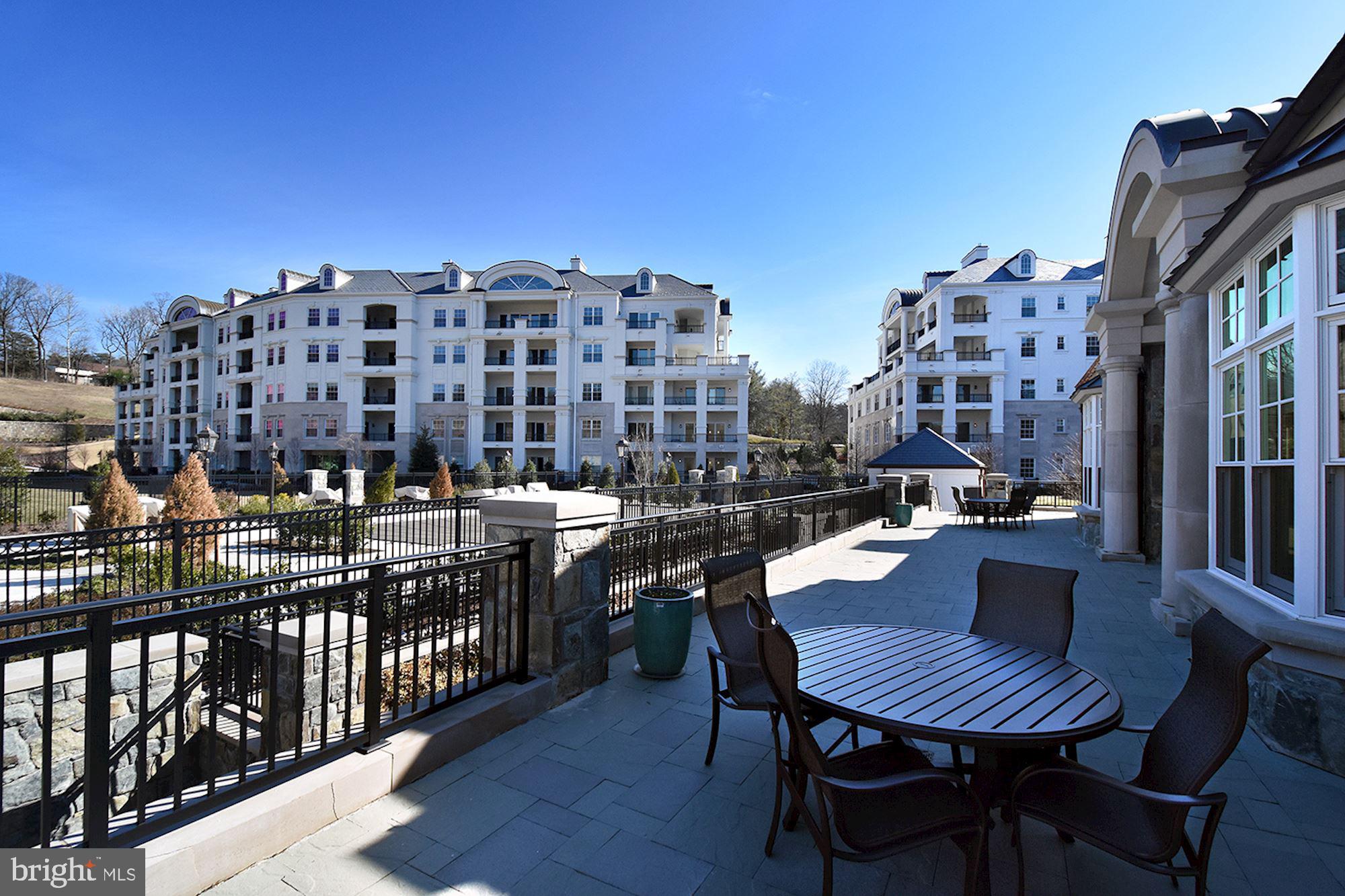 8121 River Road, Unit 451 Bethesda, MD 20817 - Photo 86 of 94 a view of a chairs and table in the balcony