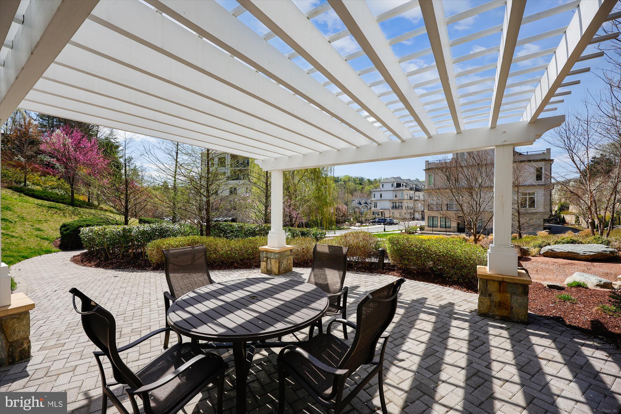 8121 River Road, Unit 451 Bethesda, MD 20817 - Photo 90 of 94 a view of a patio with couches table and chairs