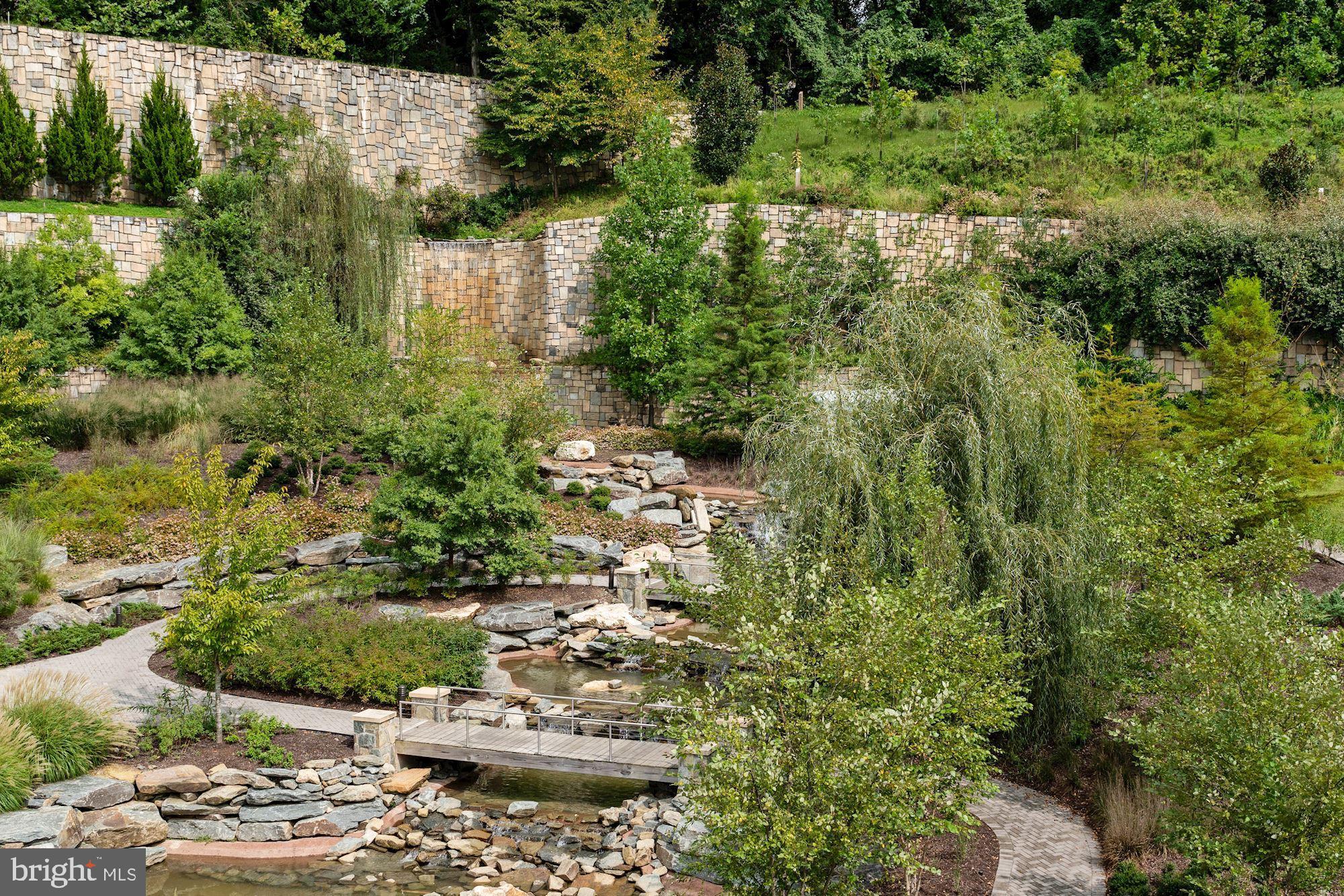 8121 River Road, Unit 451 Bethesda, MD 20817 - Photo 94 of 94 Tiered quarry rock wall and waterfall