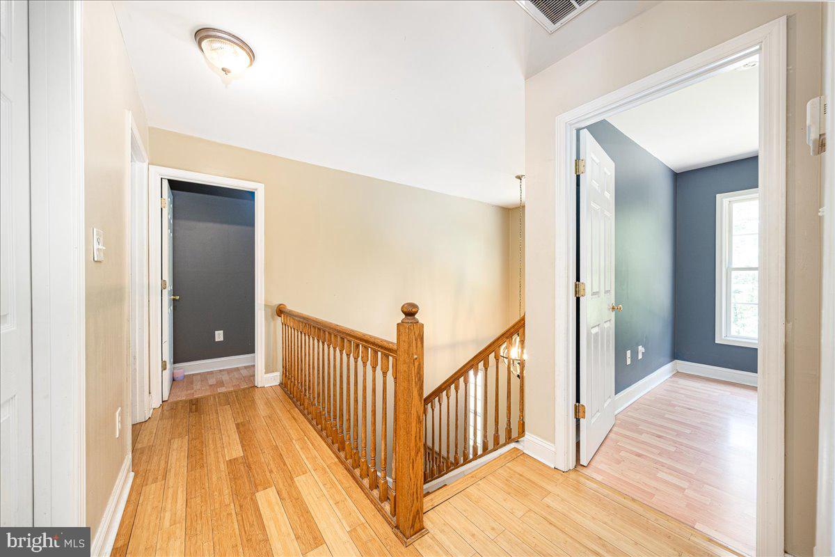 14145 Roberts Road Hancock, MD 21750 - Photo 34 of 69 a view of a hallway with wooden floor and stairs